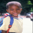 k5153 - toddler with backpack in bright tropical sunlight